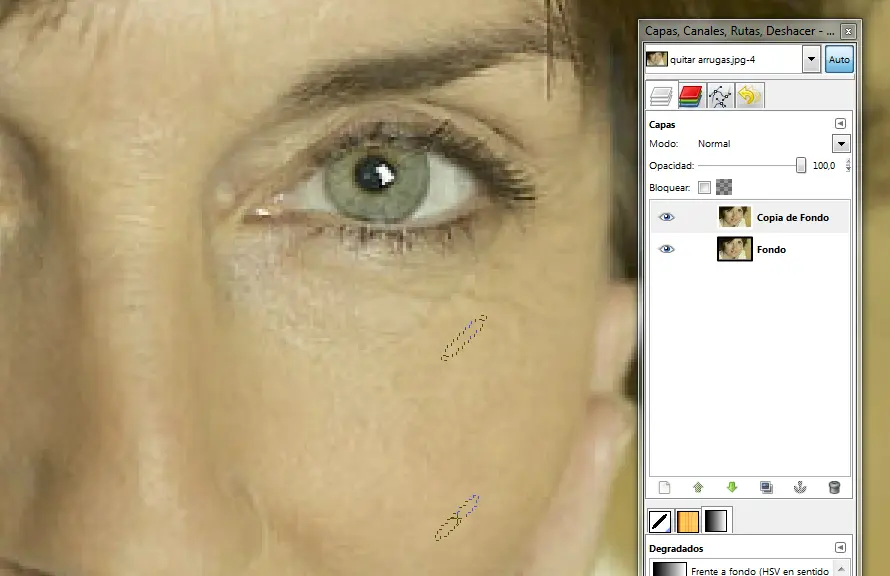 Detalle de pincel para clonar en ejercicio quitar arrugas de un rostro con Gimp